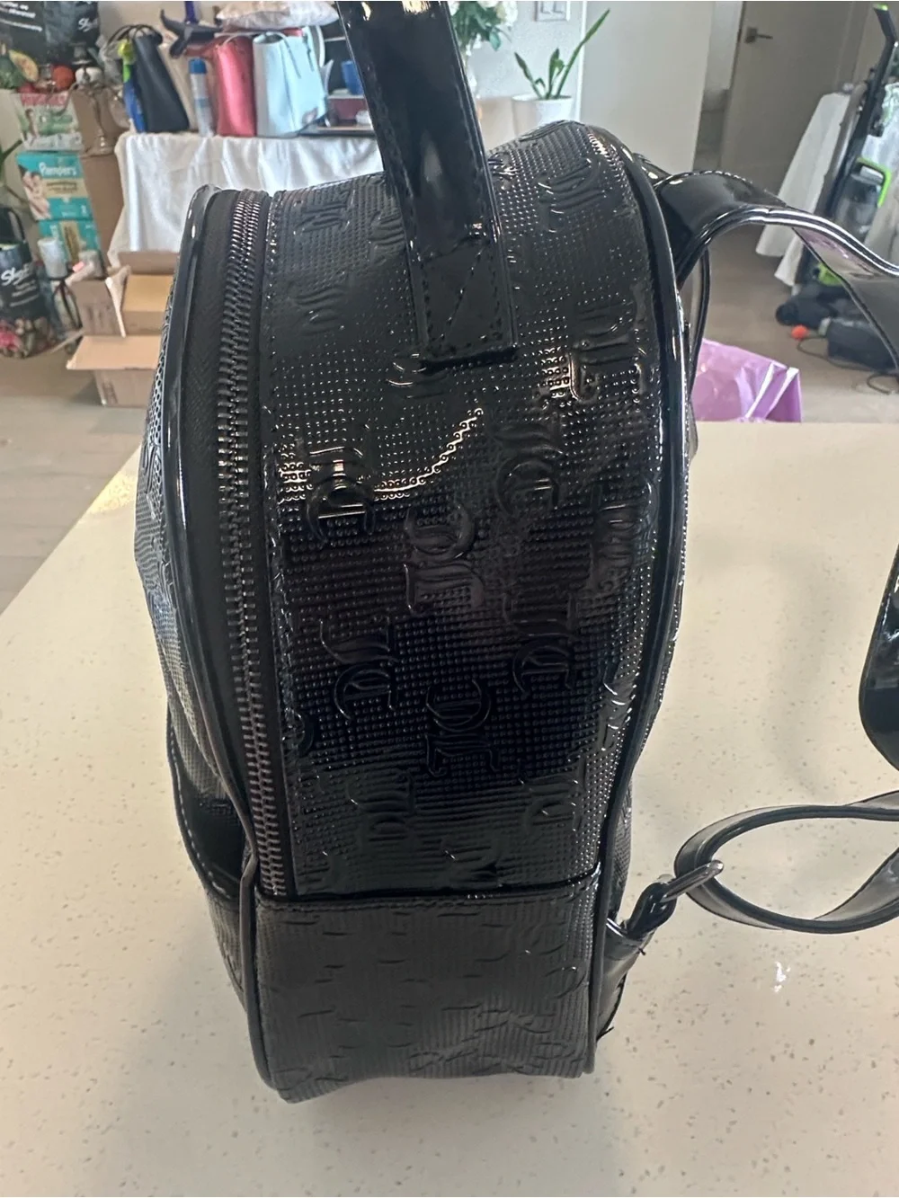 Juicy Couture Black Patent Mini Backpack, new without tags. Excellent condition.